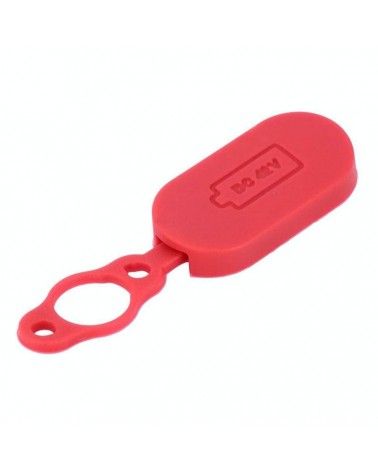 Tapón de silicona para puerto de carga de patinete eléctrico de color rojo.